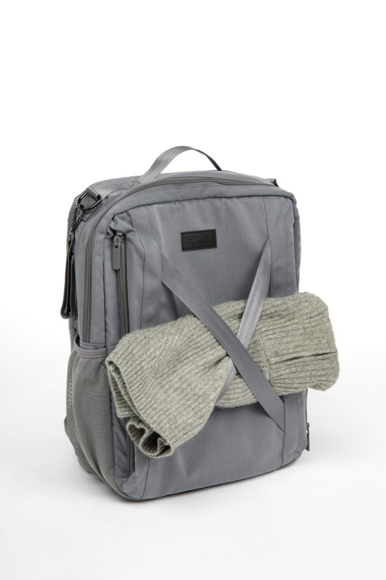 a grey backpack with a sweater wrapped around it