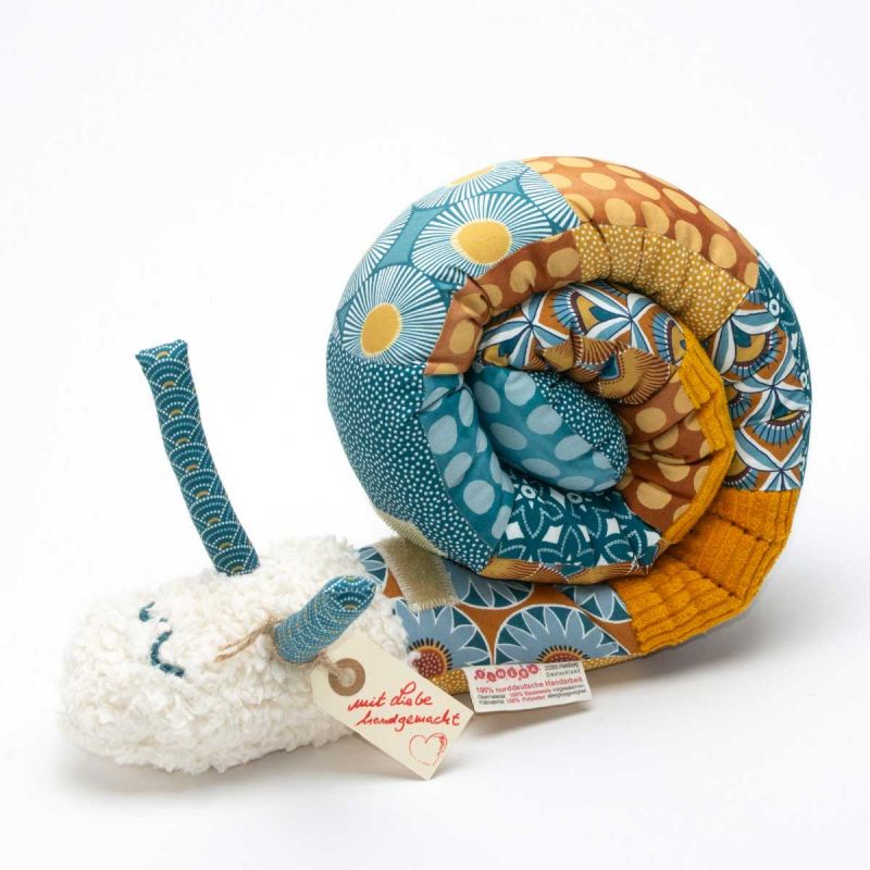 a stuffed toy snail with a tag